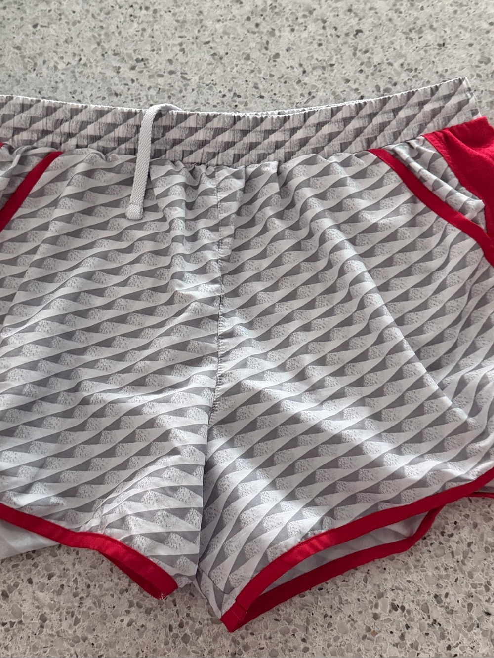 Women’s Under Armour Gray Patterned Athletic Shorts with Red Trim